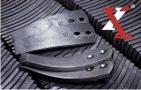 Tungsten carbide reinforced wearing parts for soil cultivation
